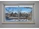 Tranquil window view showcasing distant mountains and bare trees at 4667 Ashfield Dr, Boulder, CO 80301