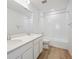 Bright bathroom featuring double vanity sinks, new fixtures, and bathtub with shower at 45915 Wood Thrush Ave, Bennett, CO 80102