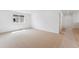 Spacious bedroom with carpet flooring and large window at 45915 Wood Thrush Ave, Bennett, CO 80102