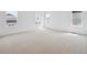 Bedroom with carpet and plenty of natural light from multiple windows at 45915 Wood Thrush Ave, Bennett, CO 80102