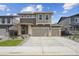 Charming two-story home featuring a two car garage, neutral color palette, and manicured landscaping at 45915 Wood Thrush Ave, Bennett, CO 80102