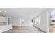 Bright living space featuring hardwood floors, natural light and an open-concept kitchen at 45915 Wood Thrush Ave, Bennett, CO 80102
