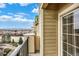 Balcony with iron railing and an exterior sliding door with nice views at 1144 Rockhurst Dr # 401, Highlands Ranch, CO 80129