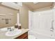 Full bathroom with a tub and shower, a neutral vanity and mirror at 1144 Rockhurst Dr # 401, Highlands Ranch, CO 80129