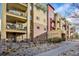 Attractive multi-story condo building with balconies and well-maintained landscaping at 1144 Rockhurst Dr # 401, Highlands Ranch, CO 80129