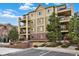 Beautiful building with private balconies, a parking garage, and appealing architectural details at 1144 Rockhurst Dr # 401, Highlands Ranch, CO 80129