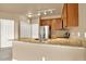 Modern kitchen featuring stainless steel appliances, granite counters, and ample storage at 1144 Rockhurst Dr # 401, Highlands Ranch, CO 80129