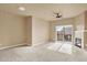 Spacious living room with a cozy fireplace and sliding glass doors to balcony at 1144 Rockhurst Dr # 401, Highlands Ranch, CO 80129