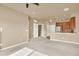 Inviting living space featuring a breakfast bar and an adjacent open kitchen layout at 1144 Rockhurst Dr # 401, Highlands Ranch, CO 80129
