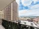 Balcony view of city buildings and blue sky with skyline in the distance at 1020 15Th St # 12C, Denver, CO 80202