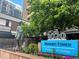 Brooks Tower building entrance with signage and landscaping at 1020 15Th St # 12C, Denver, CO 80202