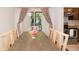 Dining room featuring stylish decor, including neutral-toned furniture and a flower centerpiece at 3341 S Monaco Pkwy # A, Denver, CO 80222