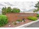 The brick sign for the Monaco Place townhome community with landscaping and plants at 3341 S Monaco Pkwy # A, Denver, CO 80222