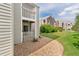 Gray siding, lush landscaping, and a cozy patio define the welcoming exterior of this property at 3341 S Monaco Pkwy # A, Denver, CO 80222