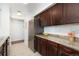 Kitchen features stainless steel refrigerator, granite countertops, and white subway tile backsplash at 3341 S Monaco Pkwy # A, Denver, CO 80222