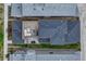 Aerial view showcases rooftop deck, backyard patio, and neat landscaping of the home at 6366 N Emporia St, Denver, CO 80238