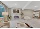 Finished basement featuring modern fireplace, mounted TV, large beanbag, and stylish decor at 6366 N Emporia St, Denver, CO 80238