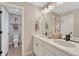 Bathroom featuring double sinks, modern fixtures, and a toilet in a separate area at 6366 N Emporia St, Denver, CO 80238