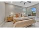 Comfortable bedroom with natural light, neutral tones, ceiling fan, and stylish bedside tables, offering a relaxing atmosphere at 6366 N Emporia St, Denver, CO 80238