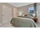 Bedroom with a large bed, side tables with lamps, carpeted floors and large closets at 6366 N Emporia St, Denver, CO 80238