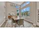 Bright dining room featuring tall windows and a stylish chandelier, creating an inviting ambiance for gatherings at 6366 N Emporia St, Denver, CO 80238