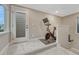 A home gym featuring exercise bike, neutral wall colors, and carpeted floors at 6366 N Emporia St, Denver, CO 80238