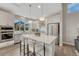 Modern kitchen featuring stainless steel appliances, a large island, and white cabinetry at 6366 N Emporia St, Denver, CO 80238