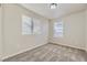 Neutral bedroom with carpet, light walls, two windows and a ceiling light at 2564 Sweet Wind Ave, Castle Rock, CO 80109