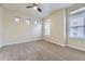 Spacious bedroom with ceiling fan, plush carpet, and bright natural light at 2564 Sweet Wind Ave, Castle Rock, CO 80109