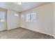 Bedroom with soft carpeting and a view through the window, natural light at 2564 Sweet Wind Ave, Castle Rock, CO 80109