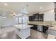 Modern kitchen features stainless steel appliances, granite countertops, and a center island at 2564 Sweet Wind Ave, Castle Rock, CO 80109