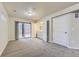 Basement with laundry room including sliding glass door to patio and white washer and dryer at 2564 Sweet Wind Ave, Castle Rock, CO 80109