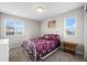 Bedroom with two windows, carpet floors, and light walls at 224 S Jackson Gap Way, Aurora, CO 80018