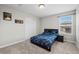 This bedroom has a window, wall decor, and a closet with sliding doors at 224 S Jackson Gap Way, Aurora, CO 80018