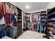 Spacious walk-in closet with ample hanging space, shelving and shoe racks at 224 S Jackson Gap Way, Aurora, CO 80018