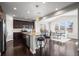 Modern kitchen with granite countertops, stainless steel appliances, and an island with bar stool seating at 224 S Jackson Gap Way, Aurora, CO 80018