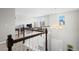 Bright loft area with railing, study space, and chandelier lighting at 224 S Jackson Gap Way, Aurora, CO 80018