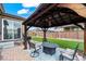 Cozy backyard patio with dining set and a gazebo; great for entertaining at 224 S Jackson Gap Way, Aurora, CO 80018