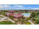 Aerial view of community pool and clubhouse surrounded by lush landscaping at 224 S Jackson Gap Way, Aurora, CO 80018