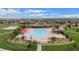 Aerial view of the community pool with red umbrellas and neighborhood views at 224 S Jackson Gap Way, Aurora, CO 80018