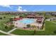 High angle shot of the community pool area with sun umbrellas and chairs at 224 S Jackson Gap Way, Aurora, CO 80018