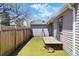 Inviting backyard with green turf, wooden fence, and space to relax at 764 S Osage St, Denver, CO 80223