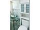 Compact bathroom featuring a stylish vessel sink and a sleek, modern design at 764 S Osage St, Denver, CO 80223