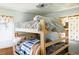 Shared bedroom featuring cozy bunk beds, and natural light enhancing the room's ambiance at 764 S Osage St, Denver, CO 80223