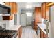 Well-lit kitchen with stainless steel appliances and ample counter space for meal preparation at 764 S Osage St, Denver, CO 80223