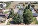 Aerial view of property highlighting backyard with mature trees and neighboring homes at 6192 S Pennsylvania St, Centennial, CO 80121