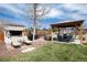 Spacious backyard with gazebo, outdoor kitchen, lounge chairs, dining area and tennis court potential at 6192 S Pennsylvania St, Centennial, CO 80121