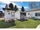 View of the backyard featuring a coop, tool shed, yard and swing at 6192 S Pennsylvania St, Centennial, CO 80121