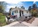 Charming backyard featuring a patio with seating, a grill, and mature trees at 6192 S Pennsylvania St, Centennial, CO 80121