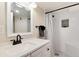 Bathroom featuring a white vanity and a glass shower with black accents at 6192 S Pennsylvania St, Centennial, CO 80121